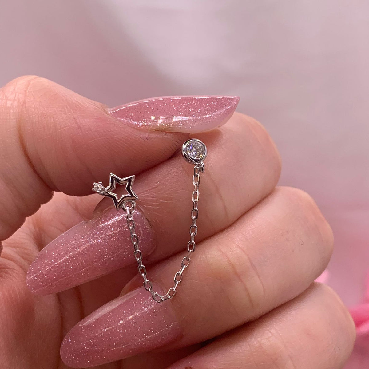 Orecchino chain star