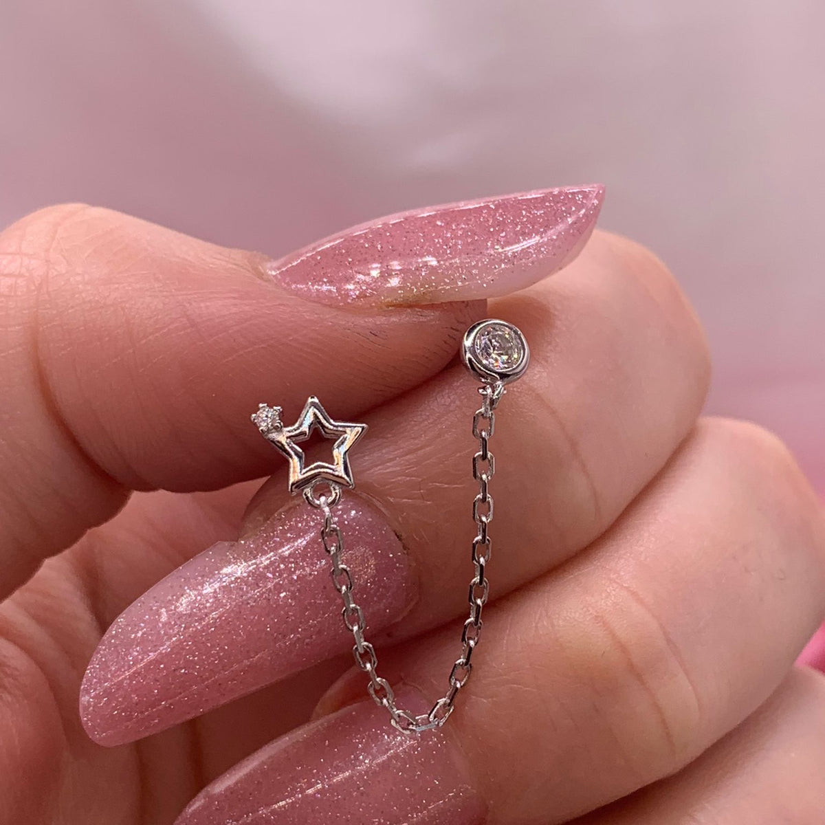 Orecchino chain star